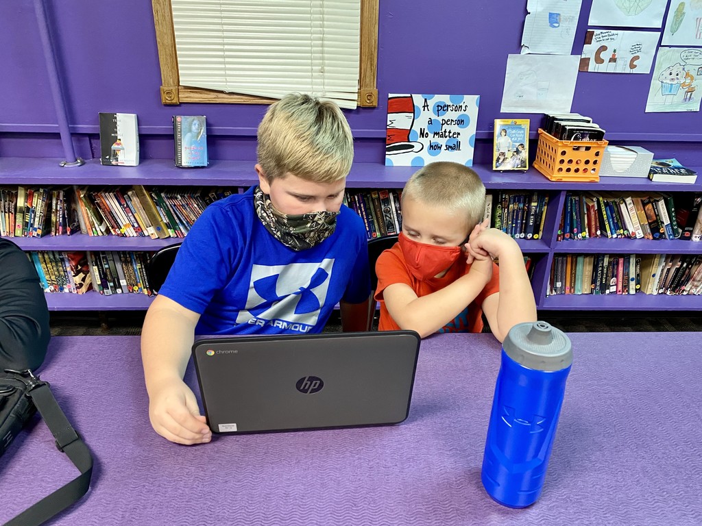 BA reading to his brother